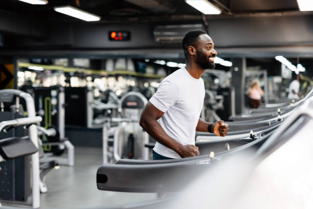 istock Man running on treadmill in gym 2158235007