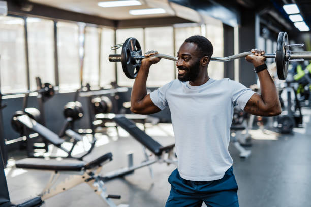 istock Individual lifting barbell in the gym 2158235666