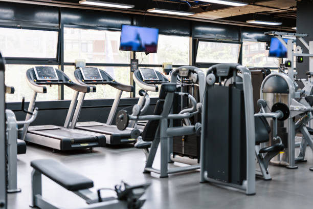 istock Wide view of a gym with cardio machines 2158236163