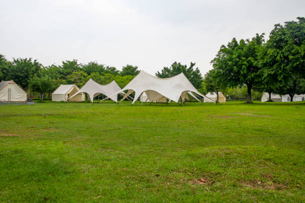 istock Camping tents on outdoor park grasslands 2158236940