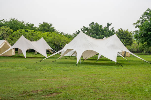 istock Camping tents on outdoor park grasslands 2158237325
