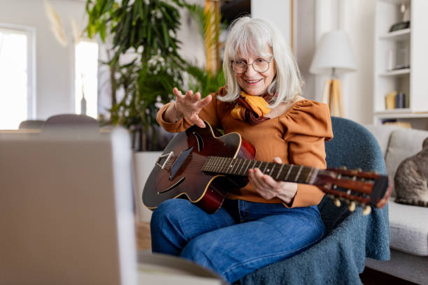 istock Senior Woman's Acoustic Guitar Session 2158238100