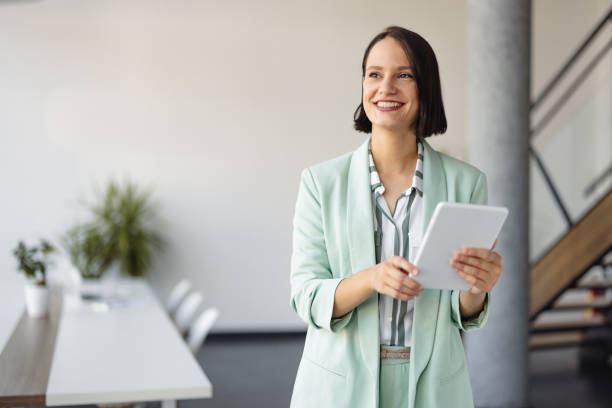 Portrait of Modern Businesswoman Using Tablet