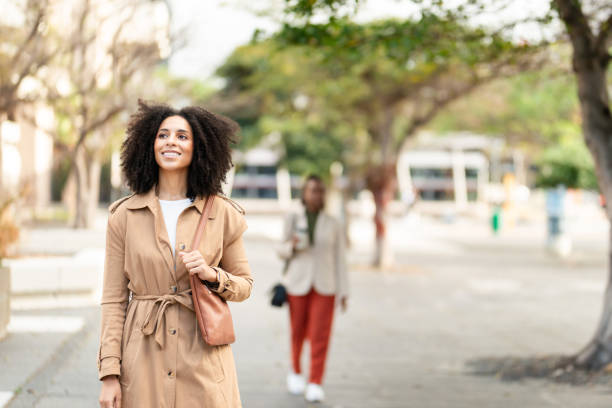 istock Confident Black Woman Entrepreneur Walking Outdoors in Urban Setting 2158240580