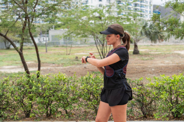 istock Woman Checking Smartwatch During Outdoor Workout 2158241320
