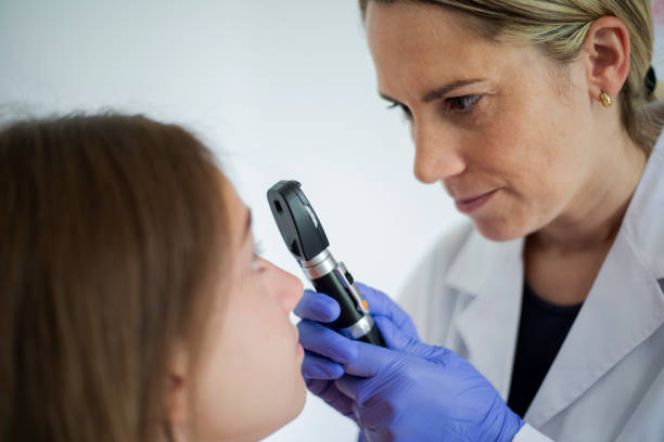 istock Female doctor checking eyes 2158243931