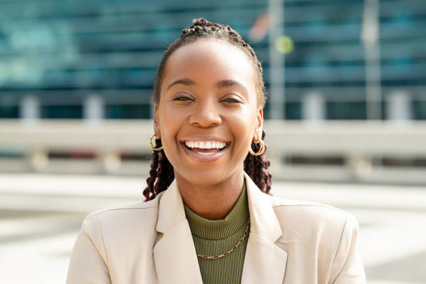 istock Confident Black Woman Entrepreneur Smiling Outdoors in Business Setting 2158244008