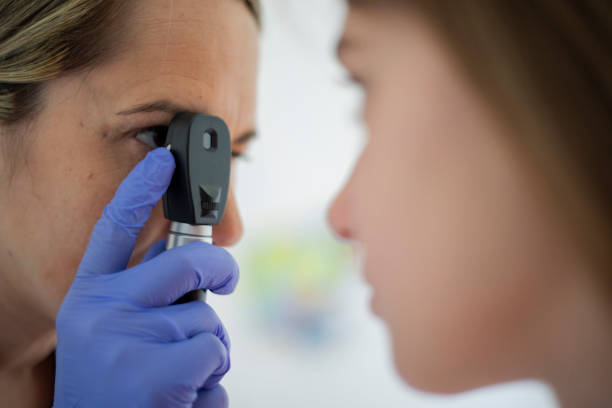 istock Female doctor checking eyes 2158244203