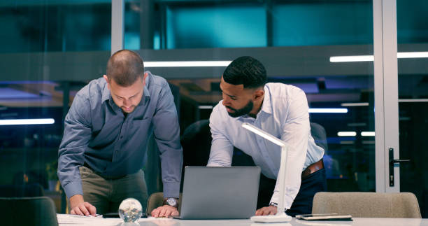 istock Detective, laptop and review in workplace together for teamwork, collaboration and partnership with strategy. Man, technology and investigation for corruption, justice and crime with video evidence 2158245545