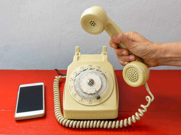 istock Rotary dial phone and smartphone 2158245585