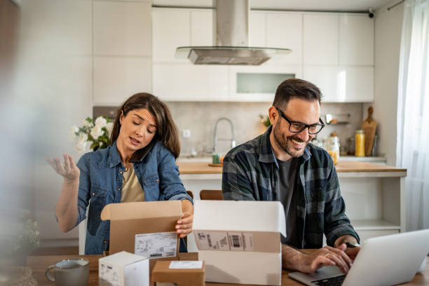 istock unpacking a package that came to them online 2158246024