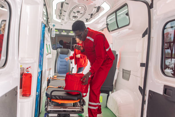 istock Paramedic preparing equipment in ambulance 2158246442
