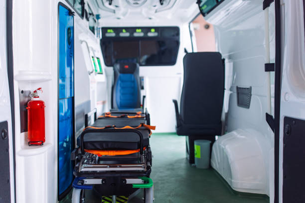 An empty and well-equipped ambulance interior showing a stretcher and medical equipment