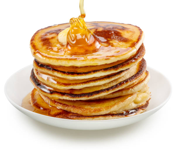 istock Pancakes and honey pouring over them on white plate. File contains clipping path 2158247520