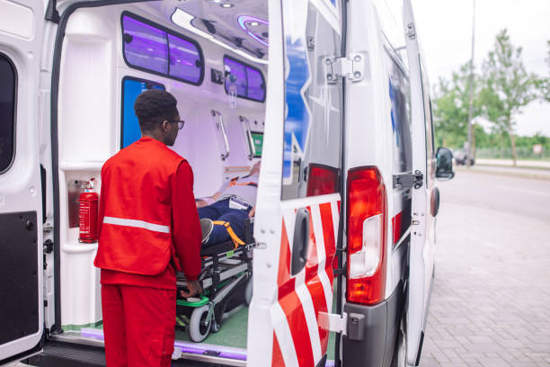 istock Paramedic with patient in medical ambulance 2158247627