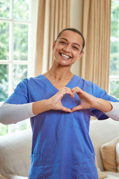 istock Portrait of a nurse making a heart shape with her hands 2158251044