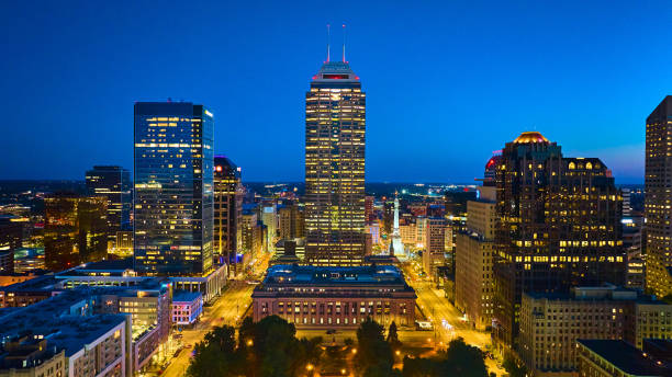 istock Aerial Twilight Indianapolis Skyline with Glowing Streets and Greenery 2158251816
