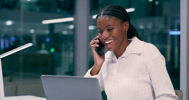 istock Office, laptop and black woman with phone call at night for data science, plan and digital consulting. IT, developer and person with smile by tech for overtime, discussion and international client 2158252548