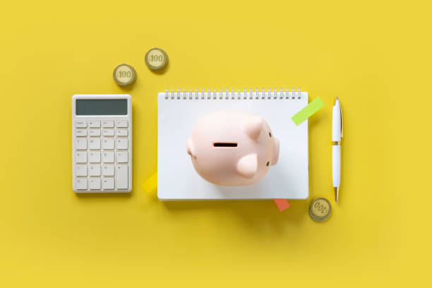 istock Financial items on yellow background. 2158252791