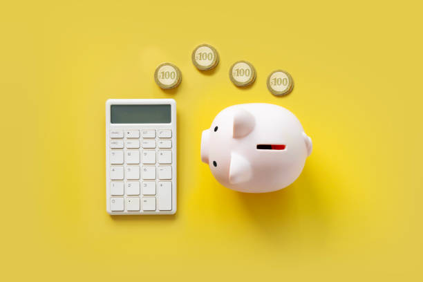 istock Financial items on yellow background. 2158252797