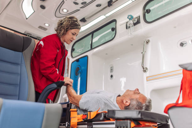 istock Medical attendant with patient in ambulance 2158252855