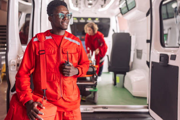istock Paramedic in red uniform holding radio 2158252919