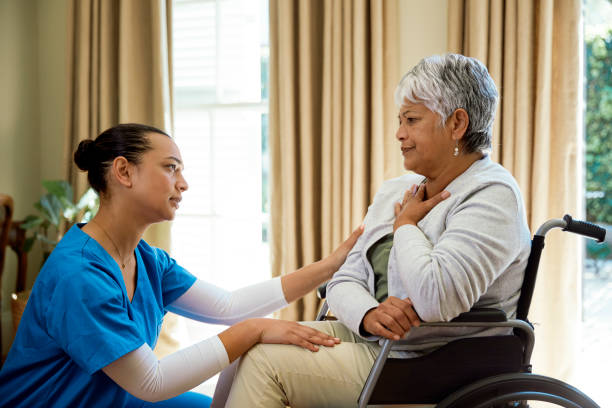 istock Nurse comforting coughing patient 2158254489