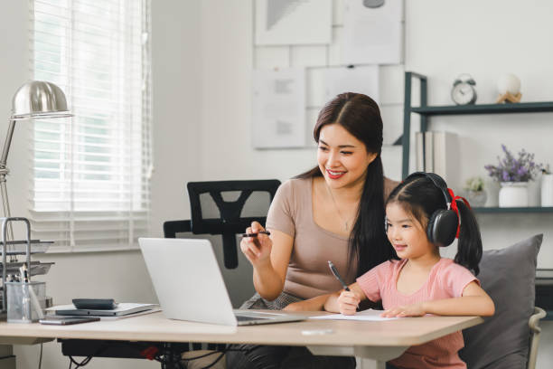 istock Mother Helping Daughter with Online Learning. 2158254551