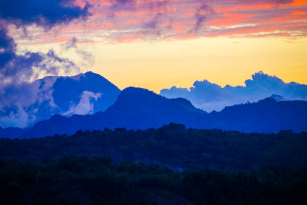 A beautiful colorful sunset behind the hills and mountains