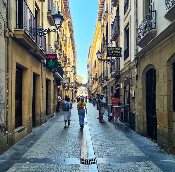 Pedestrians and shoppers on Calle Aldamar in San Sebastian, Spain. October 2023