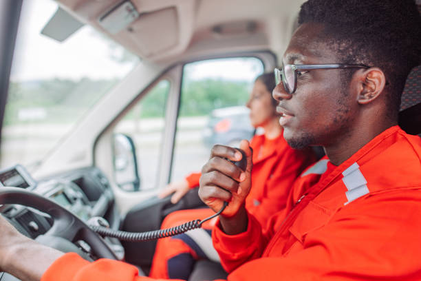 istock Paramedic communicating on radio in ambulance 2158255111
