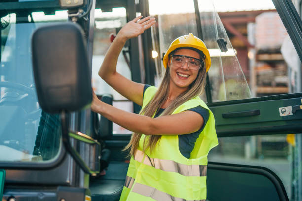 istock female worker drive drive forklift in warehouse 2158255681