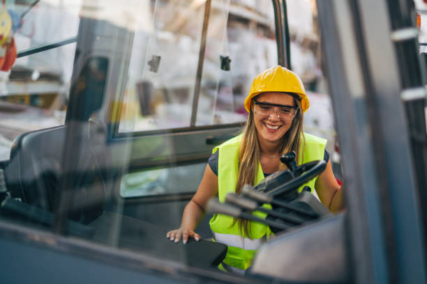 istock female worker drive drive forklift in warehouse 2158256394