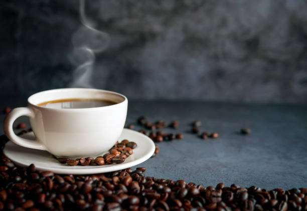 istock Coffee cup and coffee beans on  gray background, Black coffee cup aromatic 2158257231