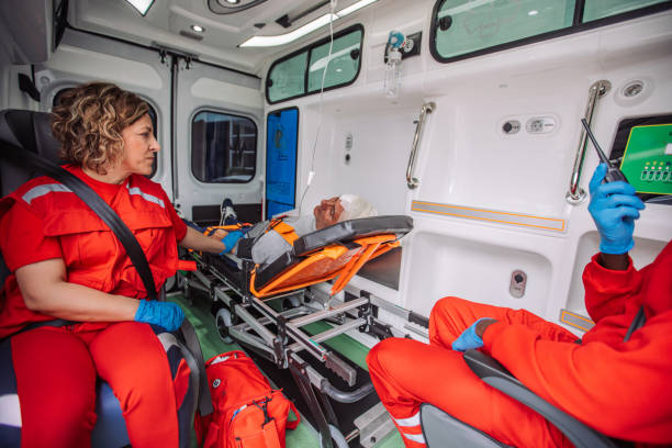 istock Female paramedic with a patient in ambulance 2158257976