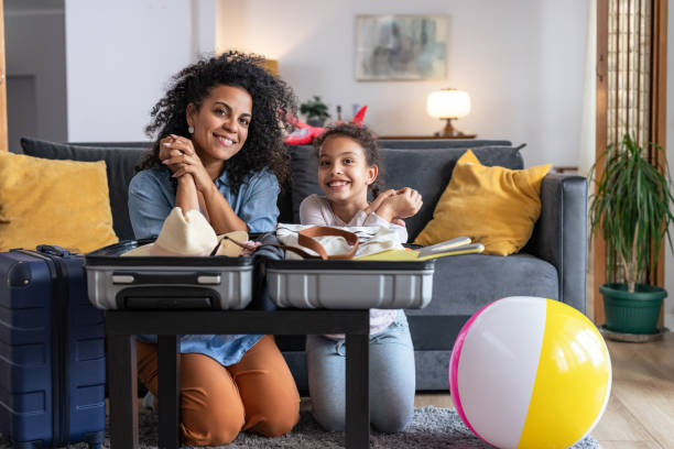 istock Mother and daughter getting ready for a beach holiday 2158259736