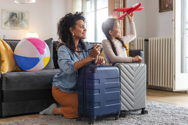 istock Mother and daughter getting ready for a beach holiday 2158259826