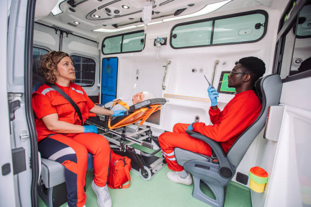 istock Paramedics converse with patient in ambulance 2158259978