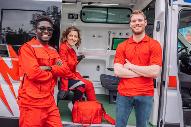 istock Smiling paramedics team with medical equipment 2158260163