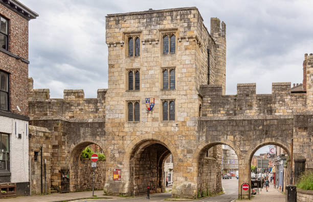 View of the old city walls promenade, and various old buildings, in Chester, Cheshire, England, UK