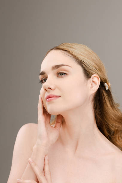 istock Charming, emotional woman uses face cream. 2158262054