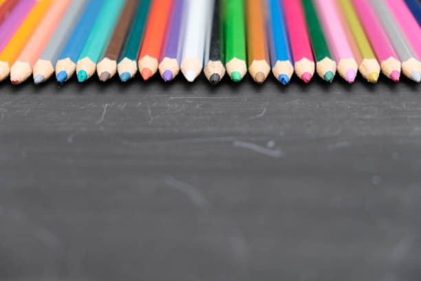Colorful pencil on the blackboard background