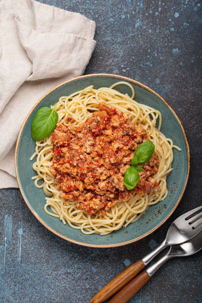 istock Spaghetti pasta dish with tomato bolognese sauce on dark rustic background 2158265739