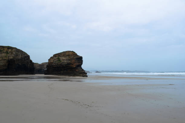 istock Cathedrals beach without people on a rainy day. 2158266945