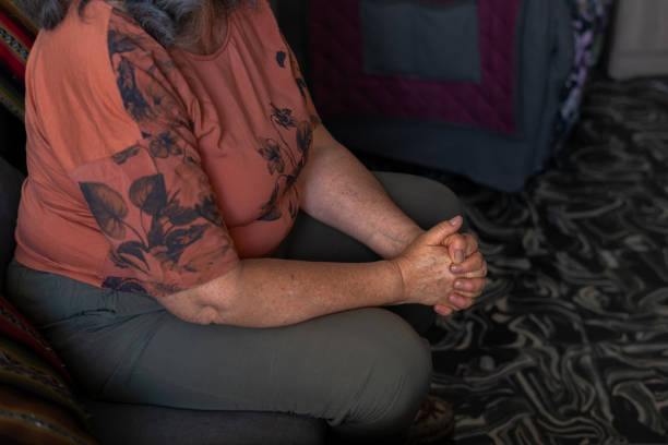 istock Elderly Woman Sitting with Hands Clasped 2158267608