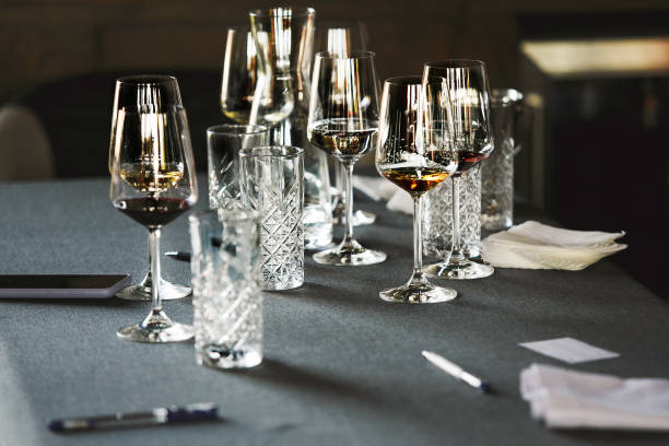 istock Various alcoholic beverages in glasses in white table in wine room. Sommelier school, professional certification, winemaking association. 2158267770