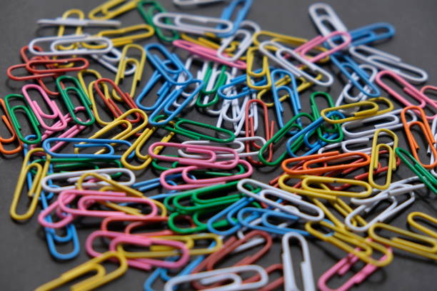 istock Multi color paperclip on the black board 2158268553