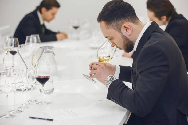 istock Sommelier degustate wine. Training of restaurant staff, studying alcohol list. Blind wine tasting. 2158268593