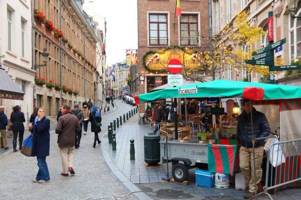 People visit Brussels restaurant area with Christmas decorations. Brussels is the capital city of Belgium. 1.8 million people live in its metro area.