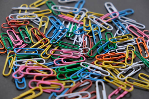 istock Multi color paperclip on the black board 2158268773
